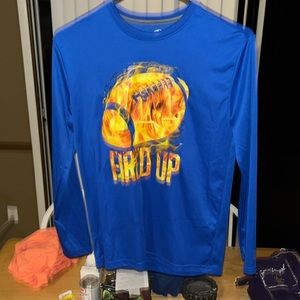 This is a Blue shirt with a cool football Logo